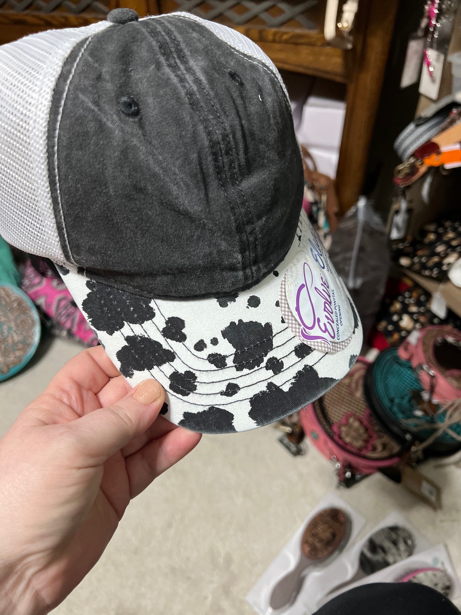 Cowprint Baseball Hat with Concealed Ponytail opening Cedar Hill Country Market