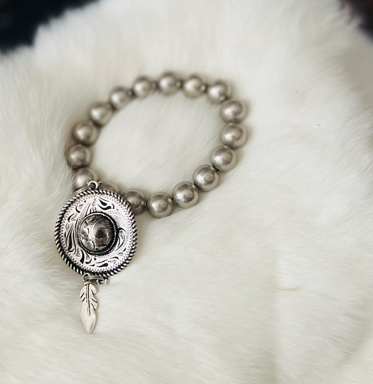 Silver Stretch Cowboy Hat and Feather Bracelet Cedar Hill Country Market